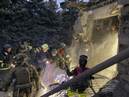 epa13293554 Ukrainian rescuers work at the site of a Russian attack on a residential area in Zaporizhzhia, Ukraine, 10 October 2026, amid the ongoing Russian invasion. At least five people, including two children, were killed and 11 others injured in overnight Russian strikes on the residential area, according to the State Emergency Service.  EPA/DARYNA...