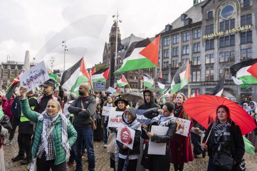 epa13296364 Demonstrators participate in a national protest in support of the Palestinian people on Dam Square in Amsterdam, the Netherlands, marking the conclusion of a nationwide week of action calling for sanctions against Israel, 11 October 2026. According to various activist groups, despite the 'ceasefire', the genocide against the Palestinian people...