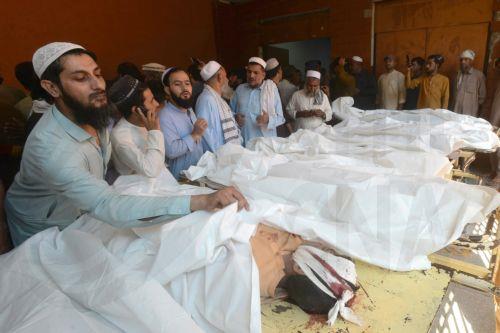 epa13306053 Parents gather beside the bodies of children killed in the collapse of a private school roof at Lady Reading Hospital in Peshawar, Khyber Pakhtunkhwa province, Pakistan, 15 October 2026. At least 17 children were killed and 20 others injured in the collapse, according to officials. Lady Reading Hospital confirmed that 17 bodies had been brought...