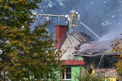epa13309162 Firefighters fight the flames of a warehouse storing agricultural tractors in Nisko, southeastern Poland, 16 October 2026. Two firefighters were killed while fighting a fire at a warehouse storing agricultural tractor parts in Nisko. The fire broke out at around 8am, and efforts to bring it under control are still ongoing.  EPA/Darek Delmanowicz...
