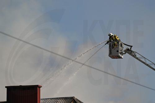 epa13309166 Firefighters fight the flames of a warehouse storing agricultural tractors in Nisko, southeastern Poland, 16 October 2026. Two firefighters were killed while fighting a fire at a warehouse storing agricultural tractor parts in Nisko. The fire broke out at around 8am, and efforts to bring it under control are still ongoing.  EPA/Darek Delmanowicz...