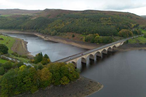 epa13309388 An aerial photograph taken with a drone of the Ladybower Reservoir which is at around 33 percent capacity, in Bamford, Britain, 16 October 2026. Most of England remains in drought as reservoir levels remain critically low after Britain experienced its hottest summer on record. A severe drought has been declared in six areas including Cornwall,...