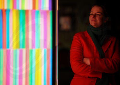 epa13323685 A person looks at 'Colour Rush’ by British artist Liz West during 'River of Light,' an illuminated outdoor art trail in Liverpool, Britain, 22 October 2026. The exhibition trail features 13 large-scale light installations based on the theme ’Together', with installations focusing on how light can bring people closer together. The installations...