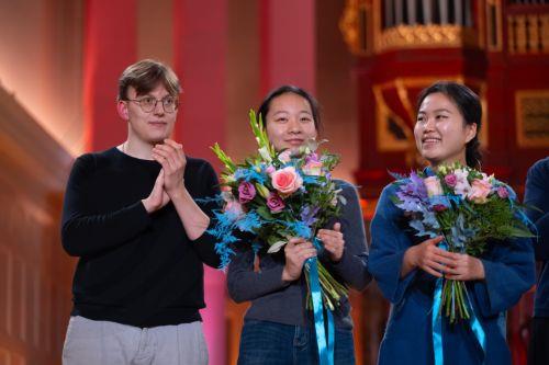 epa13324231 (L-R) Winner Ukrainian violinist Bohdan Luts, second-placed Chinese violinist Jinzhu Li and third-placed South Korean violinist SooBeen Lee pose for a photo after the final of the 17th International Henryk Wieniawski Violin Competition at the Adam Mickiewicz University in Poznan, Poland, 22 October 2026.  EPA/Marek Zakrzewski POLAND OUT