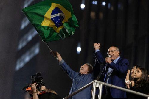 epa13332191 Brazilian President Luiz Inacio Lula da Silva (C) and Vice President Geraldo Alckmin speak to supporters celebrating their victory in Sao Paulo, Brazil, 25 October 2026.  EPA/ISAAC FONTANA
