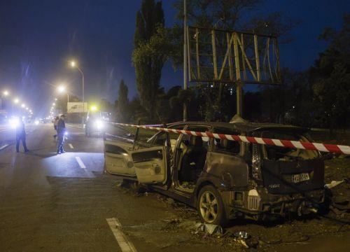 epa13333636 Ukrainian officials inspect a damaged car at the site of a Russian missile strike on a road in a residential area in Kyiv, Ukraine, 27 October 2026, amid the ongoing Russian invasion. At least one person died, and 10 others were injured during the overnight Russian ballistic missile attack, according to the State Emergency Service report. ...