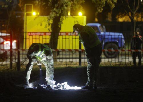 epa13333638 Ukrainian offiials inspect rocket debris at the site of a Russian missile strike on a residential area in Kyiv, Ukraine, 26 October 2026, amid the ongoing Russian invasion. At least one person died, and 10 others were injured during the overnight Russian ballistic missile attack, according to the State Emergency Service report.  EPA/SERGEY...