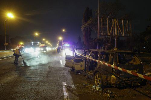 epa13333643 A damaged car at the site of a Russian missile strike on a road in a residential area in Kyiv, Ukraine, 27 October 2026, amid the ongoing Russian invasion. At least one person died, and 10 others were injured during the overnight Russian ballistic missile attack, according to the State Emergency Service report.  EPA/SERGEY DOLZHENKO