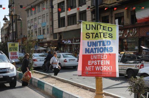 epa13336131 Iranians walk past an anti-US poster on a street in Tehran, Iran, 28 October 2026, amid the ongoing US-Iran conflict.  EPA/ABEDIN TAHERKENAREH RESTRICTIONS: NO Access Israel Media/Persian Language TV Stations Outside Iran/Strictly No Access BBC Persian/VOA Persian/Manoto TV/Iran International TV. (As mandated by Iran's Directorate General for...
