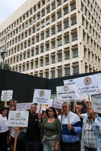 epa13336274 Bank customers and members of the Depositors Association carry placards during a protest organized by the Union of Lebanese Expatriates Depositors, a group campaigning for depositors' rights, in Beirut, Lebanon, 28 October 2026. Protesters gather outside the Lebanese Central Bank to oppose the financial regularization plan and denounce the...