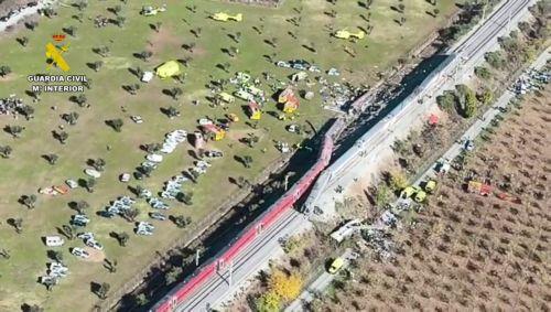 epa13336304 A handout photo made available by the Guardia Civil shows an aerial view in a frame of a video taken with a drone of the scene of the two high-speed trains (AVE in Spanish symbols), one of Renfe and another of Iryo, that have crashed in the village of Urda, Toledo, Spain, 28 October 2026. At least ten people have been killed, Spanish media...