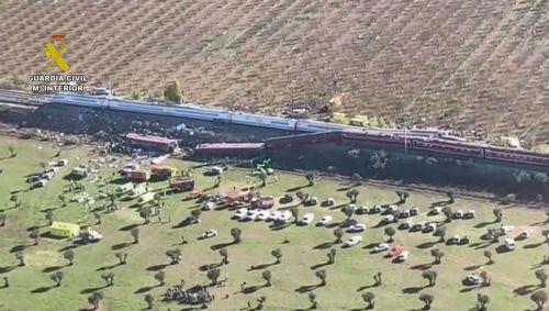 epa13336306 A handout photo made available by the Guardia Civil shows an aerial view in a frame of a video taken with a drone of the scene of the two high-speed trains (AVE in Spanish symbols), one of Renfe and another of Iryo, that have crashed in the village of Urda, Toledo, Spain, 28 October 2026. At least ten people have been killed, Spanish media...