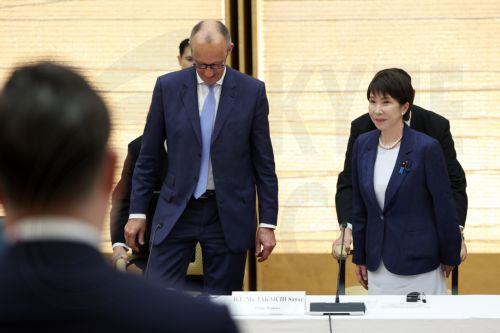 epa13336346 German Chancellor Friedrich Merz (C) and Japanese Prime Minister Sanae Takaichi (R) attend a meeting with business representatives at the prime minister's official residence in Tokyo, Japan, 28 October 2026. Merz, accompanied by a business delegation, is currently on a trip to Singapore, Japan and South Korea until 30 October.  EPA/KIYOSHI OTA /...