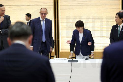 epa13336347 German Chancellor Friedrich Merz (C-L) and Japanese Prime Minister Sanae Takaichi (C-R) attend a meeting with business representatives at the prime minister's official residence in Tokyo, Japan, 28 October 2026. Merz, accompanied by a business delegation, is currently on a trip to Singapore, Japan and South Korea until 30 October.  EPA/KIYOSHI...