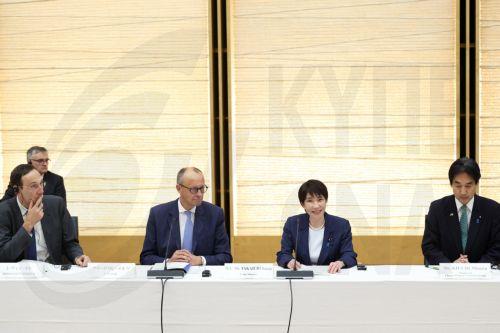 epa13336351 (L-R) Economic and Financial Policy Advisor of the German Chancellor Levin Holle, German Chancellor Friedrich Merz, Japanese Prime Minister Sanae Takaichi and Japan's Minister for Economic and Fiscal Policy Minoru Kiuchi attend a meeting with business representatives at the prime minister's official residence in Tokyo, Japan, 28 October 2026....