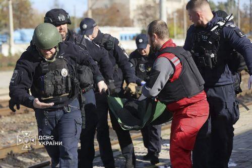 epa13339251 A handout photo released by the press service of the State Emergency Service (SES) of Ukraine shows Ukrainian rescuers evacuating an injured person at the site of a Russian drone strike on a platform at the railway station in Dnipro, central Ukraine, 29 October 2026, amid the Russian invasion. At least 14 people were killed and 14 others injured...