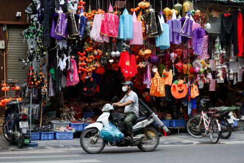 epaselect epa13340466 A man rides past a shop selling Halloween decorations and costumes in Hanoi, Vietnam, 30 October 2026. Halloween is celebrated annually on 31 October and has gained increasing popularity among younger generations in Vietnam.  EPA/LUONG THAI LINH