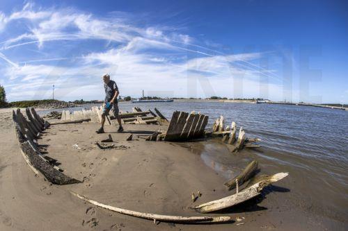 epa10104300 The wreck of the dynamite ship Elisabeth, which exploded in 1895, has become visible due to the low water level in the Rhine near the Dutch-German border at Spijk and Tolkamer, at Griethausen, the Netherlands, 03 August 2022. Shipping on all major rivers except the Meuse suffers from reduced navigation depths because the water level continues to...