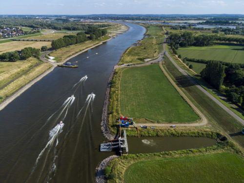epa10104356 A picture taken with a drone shows De Pannerling pumping station at the Pannerdensch Canal, the Netherlands, 03 August 2022.  Due to the low water in the Rhine, there are extra pumps to get water into the Linge. Shipping on all major rivers except the Meuse suffers from reduced navigation depths because the water level continues to drop due to a...