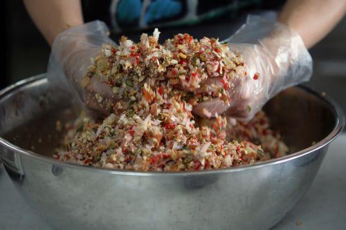 epa10139419 A worker mixes the ingredients to make mooncakes at a bakery in Hanoi, Vietnam 26 August 2022. Mid-Autumn Festival, also known as Moon Festival, is a special festival for Vietnamese children as the celebrations involving lion dance, lantern processions and mooncakes. This year the festival falls on 10 September.  EPA/LUONG THAI LINH