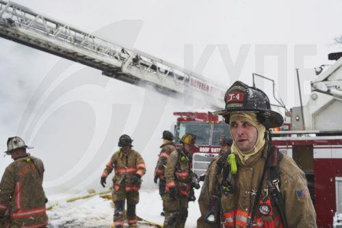 epa10378758 Firefighters work to extinguish a house fire on Lonsdale Road as the area continues to deal with the effects of a massive winter storm which has affected large portions of the United States, continues in Buffalo, New York, USA, 26 December 2022. Much of the United States experienced some sort of winter weather this week as result of the large...