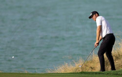 epa10414903 Seamus Power of Ireland in action during the first round of the Abu Dhabi HSBC Golf championship 2023 in Abu Dhabi, United Arab Emirates, 19 January 2023.  EPA/ALI HAIDER