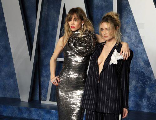 epa10520266 Suki Waterhouse (L) and Immy Waterhouse (R) arrive at the 2023 Vanity Fair Oscar Party following the 95th annual Academy Awards ceremony, at the Wallis Annenberg Center for the Performing Arts in Beverly Hills, California, USA, 12 March 2023. The Oscars are presented for outstanding individual or collective efforts in filmmaking in 24...