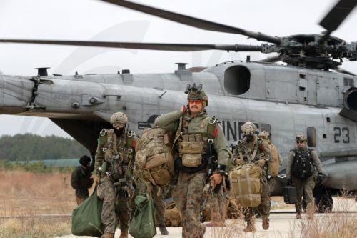 epa10537819 US Marines disembark the Sikorsky CH-53E Super Stallion, a heavy-lift helicopter, during combined airborne and maritime infiltration drills with South Korean and British troops in Pohang, South Korea, 22 March 2023 (issued 23 March 2023). The two-day drills, which will run through the following day, are part of the ongoing South Korea-US...