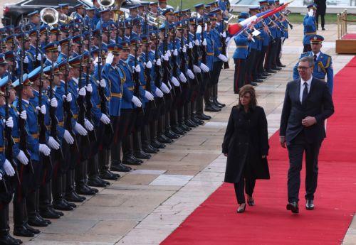 epa10546701 Serbian President Aleksandar Vucic (R) and Greek President Katerina Sakellaropoulou (L) inspect the honor guards ahead of their meeting in Belgrade, Serbia, 28 March 2023. President Sakellaropoulou is on an official visit to Serbia.  EPA/ANDREJ CUKIC