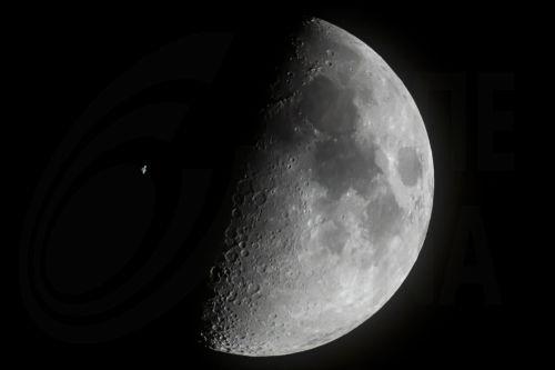 epa10550003 The International Space Station (ISS) passes in front of the Moon as captured near Buzitka, southern Slovakia, 29 March 2023 (issued 30 March 2023).  EPA/Peter Komka HUNGARY OUT