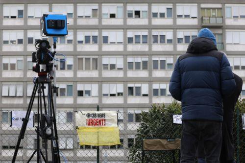 epa10551946 A media position outside the Agostino Gemelli Hospital where the pope is currently hospitalized, in Rome, Italy, 31 March 2023. Pope Francis was hospitalized on 29 March following a respiratory infection (excluding Covid-19) which will require a few days of appropriate hospital medical therapy, according to the Vatican.  EPA/FABIO FRUSTACI