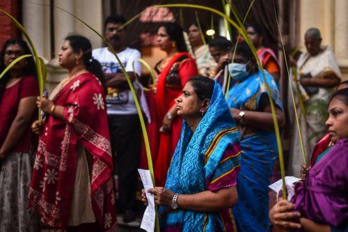 epa10555093 Indian Christians hold palm fronds as they take part in a religious procession on the occasion of Palm Sunday, at a church, in Chennai, India, 02 April 2023. Palm Sunday for Roman Catholic devotees symbolically marks the biblical account of the entry of Jesus Christ into Jerusalem, signaling the start of the Holy Week, prior to Easter. ...