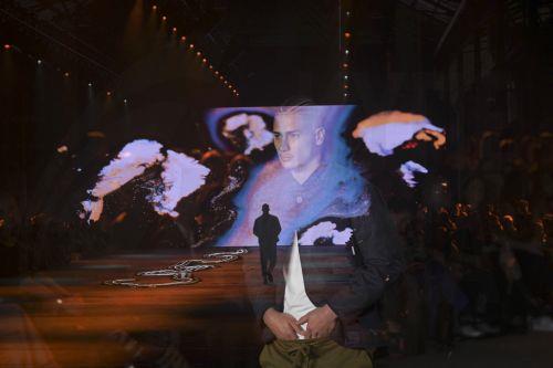 epa10634051 A photo taken with multiple exposure shows models walking the runway at the David Jones Indigenous fashion show during Australian Fashion Week 2023 at Carriageworks in Sydney, New South Wales, Australia, 17 May 2023.  EPA/FLAVIO BRANCALEONE AUSTRALIA AND NEW ZEALAND OUT