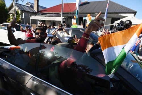 epa10646958 Members of the Indian community in the suburb of Harris Park celebrate in anticipation of a potential visit by India's Prime Minister Narendra Modi to what is known as Little India, in Sydney, Australia, 23 May 2023. Prime Minister Modi has an official engagement tonight with members of the Indian community at Qudos Bank Arena.  EPA/DEAN LEWINS...