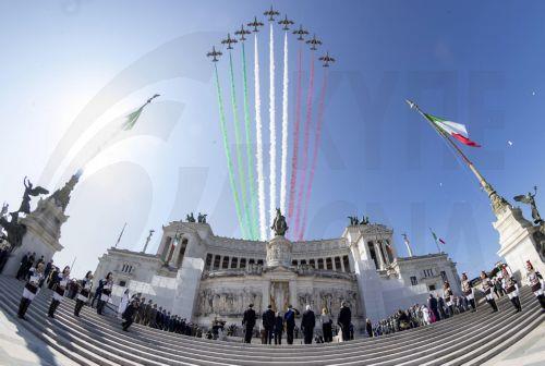 epa10668919 A handout picture made available by the Quirinal Presidential Palace (Palazzo del Quirinale) Press Office shows the Italian Air Force's aerobatic display team, the Frecce Tricolori, flying over the monument as Italian President Sergio Mattarella laid a laurel wreath on the Tomb of the Unknown Soldier at the Altar of the Fatherland, during...