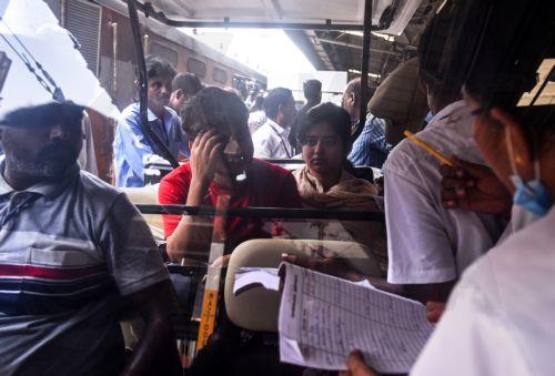 epa10674392 Passengers who survived the triple train accident in Odisha's Balasore district arrive on a second special train, at the Chennai Central railway station, in Chennai, India, 05 June 2023. Medical teams arrived at the Central railway station to provide medical care for affected survivors. Over 200 people died and more than 900 were injured after...