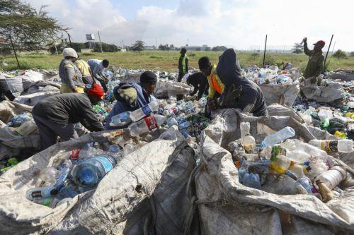 epa10674420 Workers sort out plastic bottles at the T3 EPZ Limited, a local company that recycles polyethylene terephthalate (PET) plastic bottles into PET flakes for export, on World Environment Day in Machakos, Kenya, 05 June 2023. The world marks the 2023 Environment Day on 05 June with a focus on 'solutions to plastic pollution'.  EPA/DANIEL IRUNGU ...