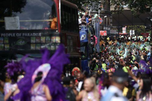 epa10825428 Carnival goers take part in the Notting Hill Carnival in London, Britain, 28 August 2023. Notting Hill is the largest street carnival in Europe and a community-led celebration of Caribbean history and culture, this year running from 27 to 28 August.  EPA/NEIL HALL