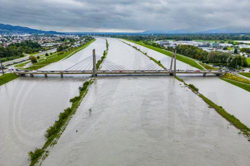 epa10825511 A picture taken with a drone shows waters of the Rhine river flooding some land between the dams after heavy rainfall in Diepoldsau, canton St. Gallen, Switzerland, 28 August 2023. Especially in the south and east of Switzerland, enormous sums of rain accumulated.  EPA/YANIK BUERKLI