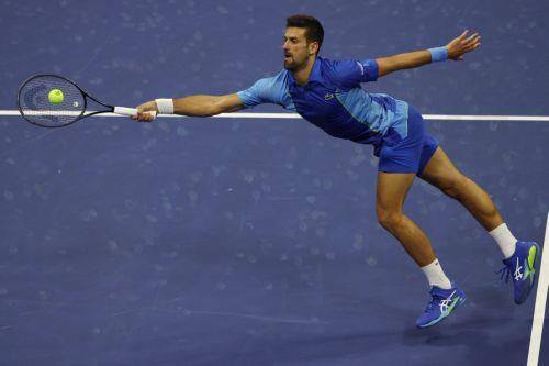 epa10839053 Novak Djokovic of Serbia returns the ball to Borna Gojo of Croatia during their fourth round match at the US Open Tennis Championships at the USTA National Tennis Center in Flushing Meadows, New York, USA, 03 September 2023. The US Open runs from 28 August through 10 September.  EPA/BRIAN HIRSCHFELD