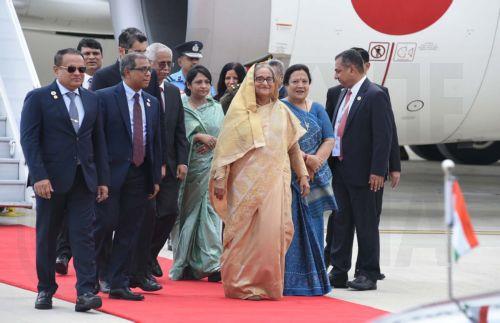 epa10847863 A handout picture made available by the Indian Press Information Bureau (PIB) shows The Prime Minister of Bangladesh, Smt. Sheikh Hasina (C) receives warm welcome by the Union Minister of State for Agriculture & Farmersâ€™ Welfare, Smt. Shobha Karandlaje on her arrival for the G20 Summit at Palam Airforce Airport, in New Delhi, India, 08...