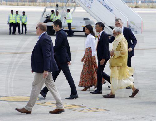 epa10847922 A handout picture made available by the Indian Press Information Bureau (PIB) shows The Prime Minister of the United Kingdom, Mr. Rishi Sunak and his wife Akshata Murty receive warm welcome by the Union Minister of State for Agriculture & Farmersâ€™ Welfare, Smt. Shobha Karandlaje on her arrival for the G20 Summit at Palam Airforce Airport, in...
