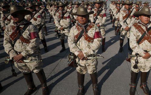 epa10986571 Soldiers take part in the parade commemorating the 113 anniversary of the Mexican Revolution, at the Plaza Constitucion Square, in Mexico City, Mexico, 20 November 2023.  EPA/ISAAC ESQUIVEL