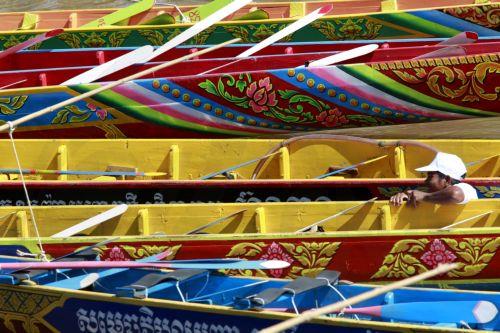 epa10997138 A Cambodian rower prepares his boat during the annual Water Festival in the Tonle Sap River in Phnom Penh, Cambodia, 27 November 2023. The three-day festival will see teams from across Cambodia compete in boat races between the Mekong and Tonle Sap rivers. The festival runs from 26 November to 28 November 2023, after a three year hiatus. ...