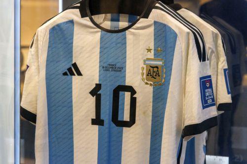epa11003463 The shirt from the final between Argentina and France is one of the six match-worn shirts of Argentine soccer player Lionel Messi from the 2022 FIFA World Cup that are on display before auction at Sotheby's in New York, New York, USA, 30 November 2023. The set of six shirts will be offered in a dedicated sale open for bidding from 30 November to...
