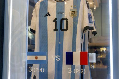 epa11003467 The shirt from the final between Argentina and France is one of the six match-worn shirts of Argentine soccer player Lionel Messi from the 2022 FIFA World Cup that are on display before auction at Sotheby's in New York, New York, USA, 30 November 2023. The set of six shirts will be offered in a dedicated sale open for bidding from 30 November to...