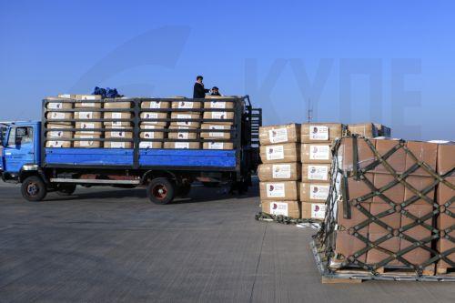 epa11004693 Airport staff offload winter aid sent from Qatar aboard a Qatar Air Force aircraft for earthquake victims, in Herat, Afghanistan, 30 November 2023. The Qatari government sent 70 tons of aid to Herat, Afghanistan to support earthquake victims. The first shipment included food, health kits, blankets, and dates, with two additional planes expected...