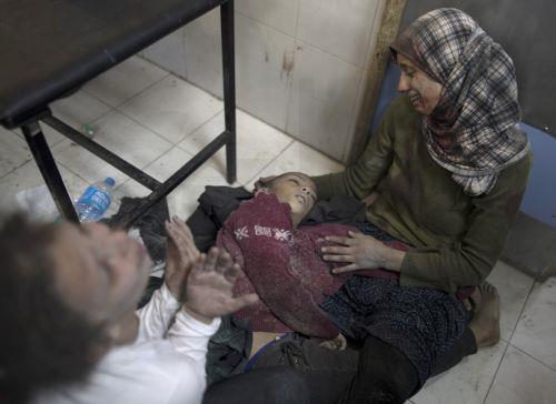 epaselect epa11015309 A woman reacts next to the body of her dead son at Nasser Hospital in Khan Yunis, following Israeli airstrikes on southern Gaza, 07 December 2023. Israeli forces resumed military strikes on Gaza after a week-long truce ended on 01 December. More than 16,000 Palestinians and at least 1,200 Israelis have been killed, according to the...