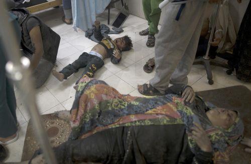 epaselect epa11015311 People wounded in Israeli airstrikes on southern Gaza lie on the floor at Nasser Hospital in Khan Yunis, southern Gaza Strip, 07 December 2023. Israeli forces resumed military strikes on Gaza after a week-long truce ended on 01 December. More than 16,000 Palestinians and at least 1,200 Israelis have been killed, according to the...