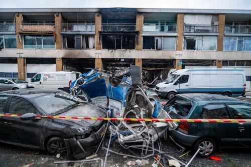 epa11113422 A view of the damage to an apartment complex on Schammenkamp in Rotterdam, The Netherlands, The Netherlands, 30 January 2024, the day after a major fire. Several people were injured by an explosion and subsequent fire. The explosion took place underneath the building, which consists of a layer of business units with two residential floors above....